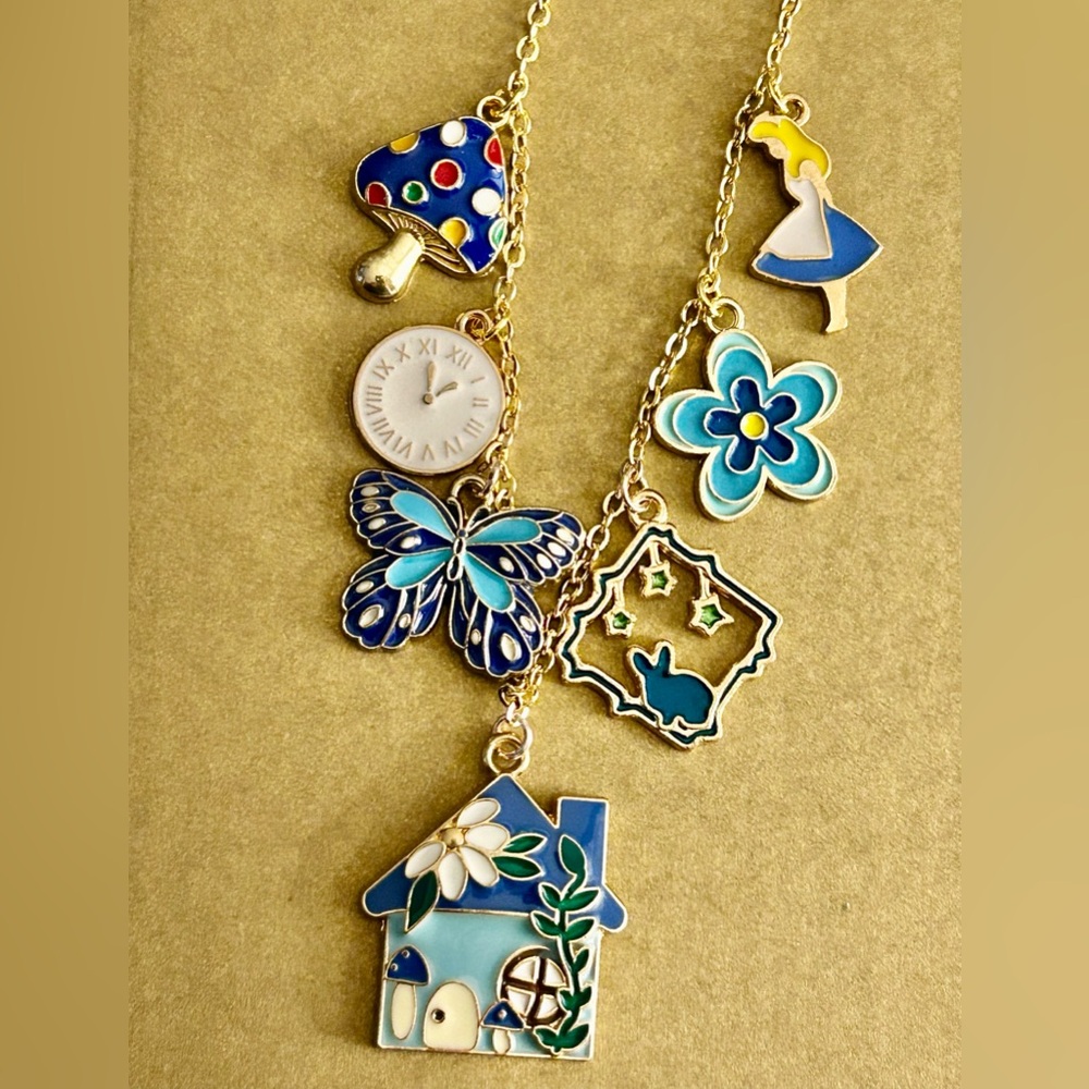 NWOT Necklace Alice in Wonderland, blue enamel charms rabbit, flower, cat… 21” - Picture 2 of 6